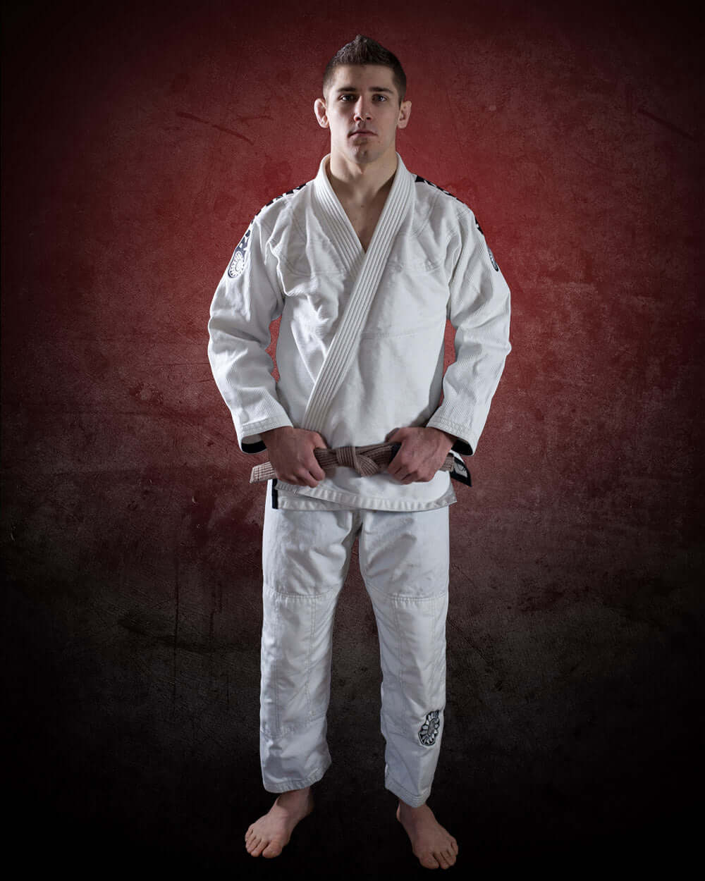 Roninbrand 47 BJJ Gi - White on a male model, showcasing professional fit and design for Brazilian Jiu Jitsu training.