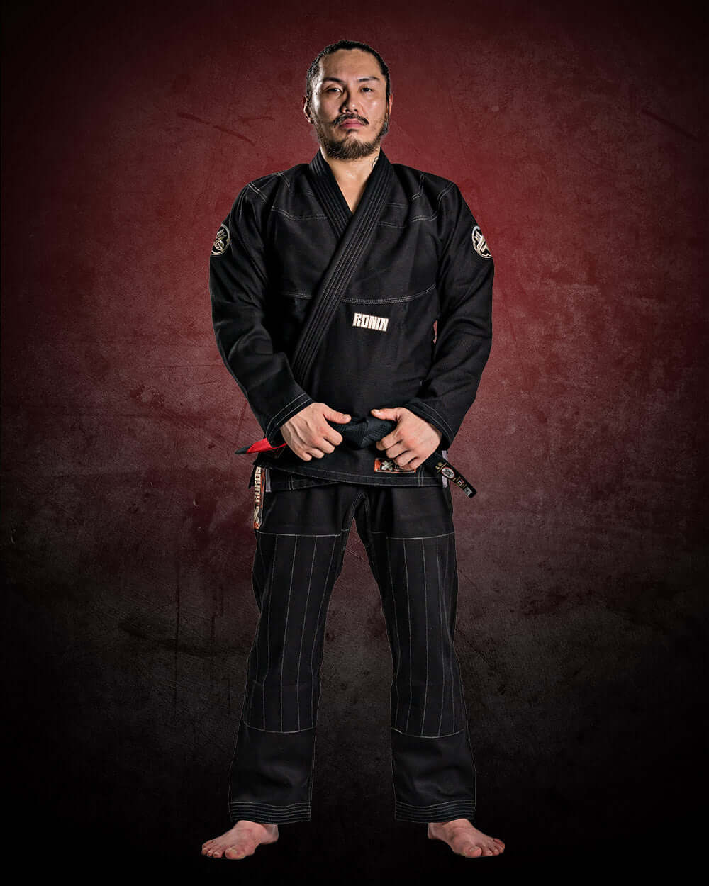 Roninbrand Kurosawa BJJ Gi in black worn by a fighter, showcasing elegance and strength for professional Brazilian Jiu Jitsu.