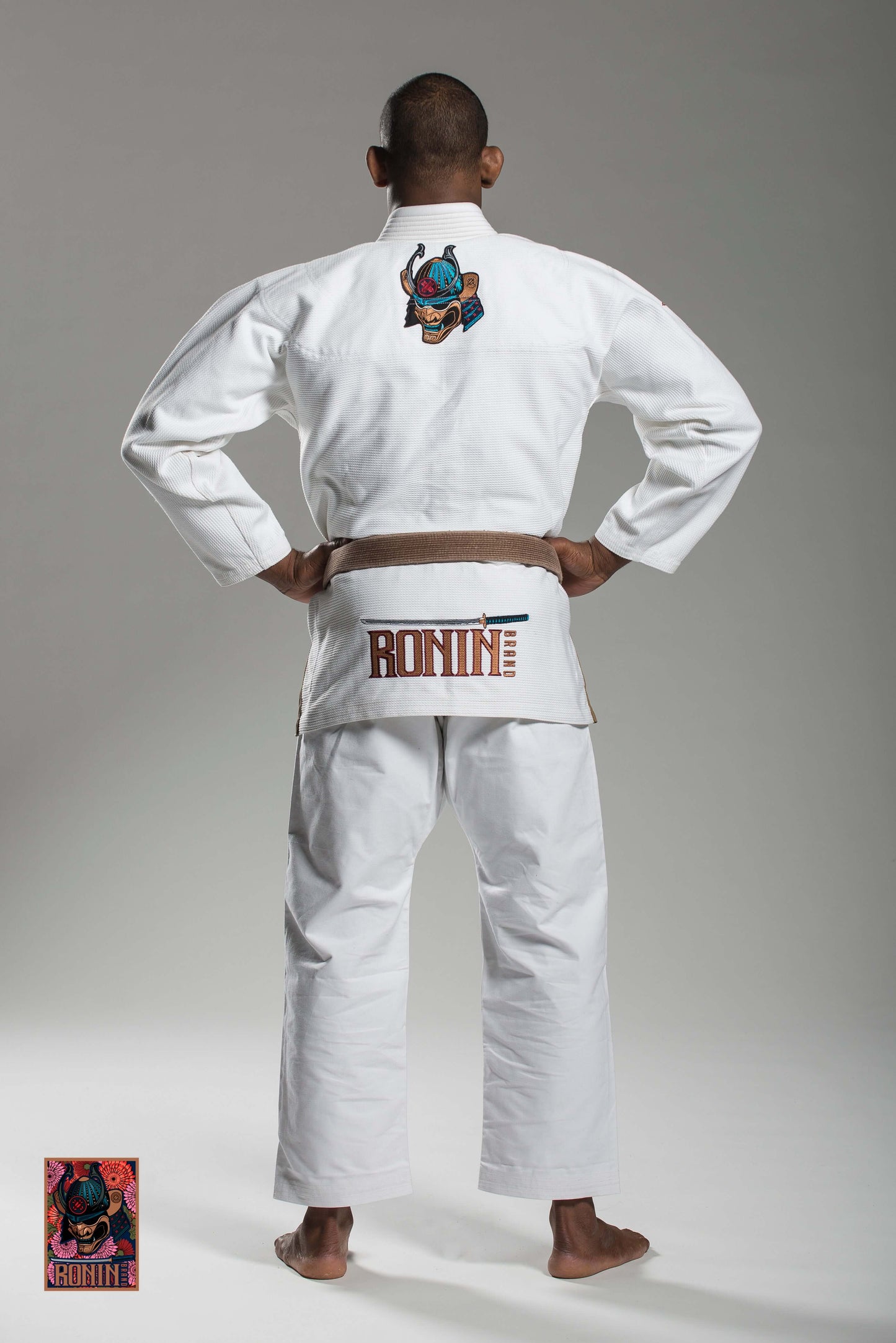 Man wearing Roninbrand Emperor BJJ Gi - White showcasing back design, ideal for BJJ grappling and combat.