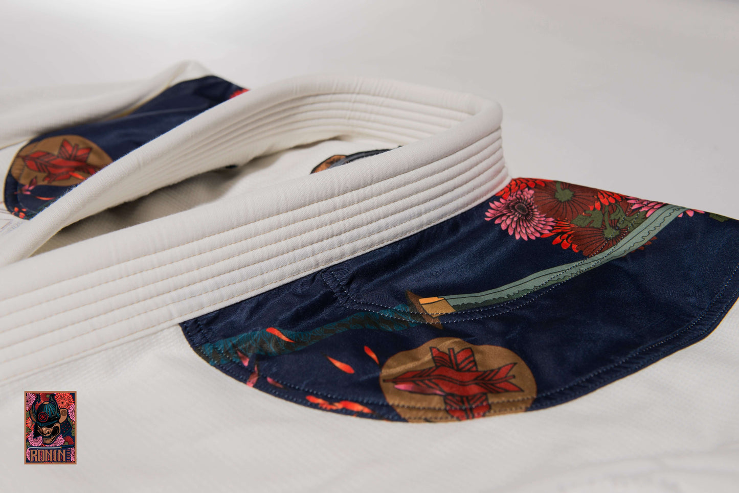 Roninbrand Emperor BJJ Gi collar detail showcasing intricate chrysanthemum embroidery and premium fabric design.