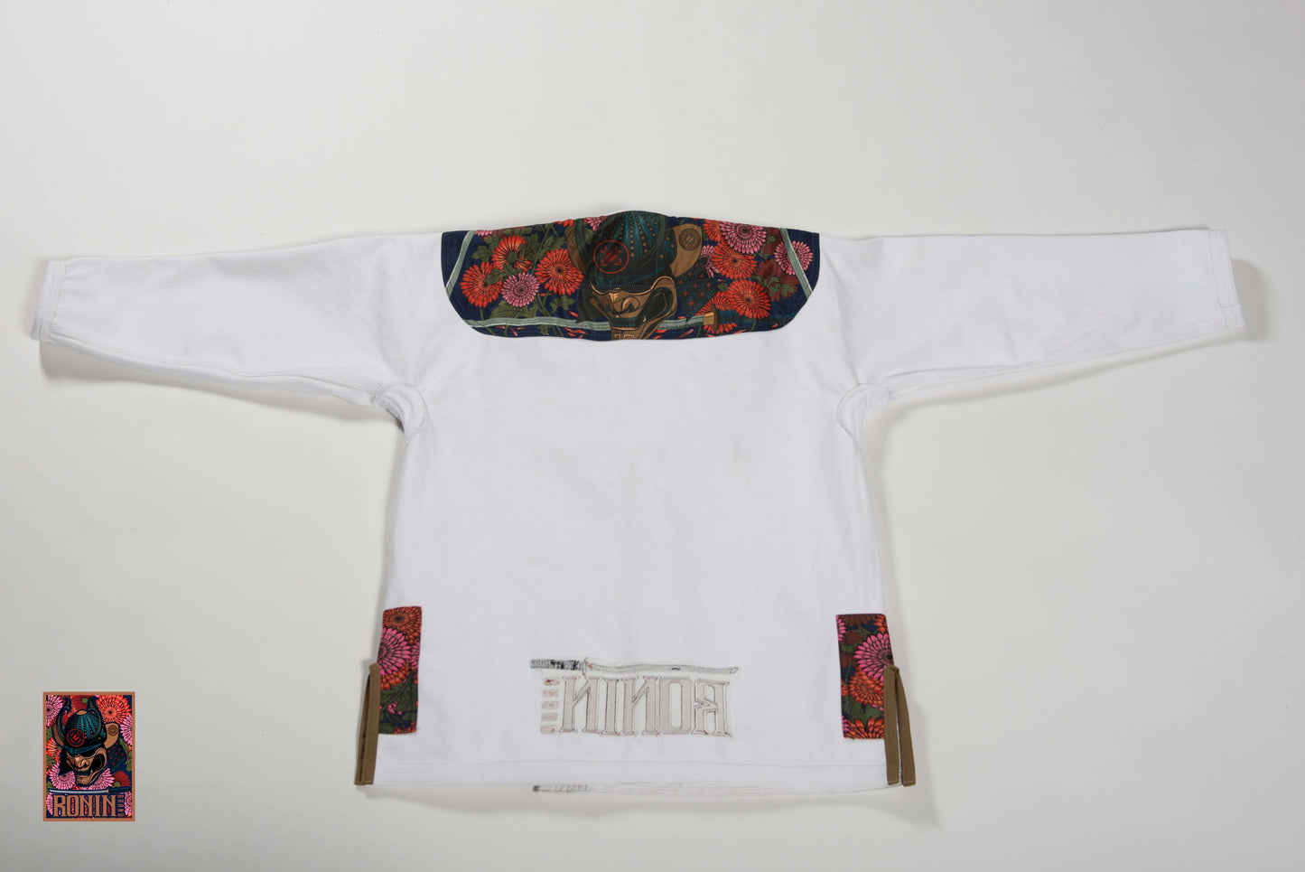 Roninbrand Emperor BJJ Gi in white with intricate chrysanthemum embroidery for Brazilian Jiu Jitsu performance.
