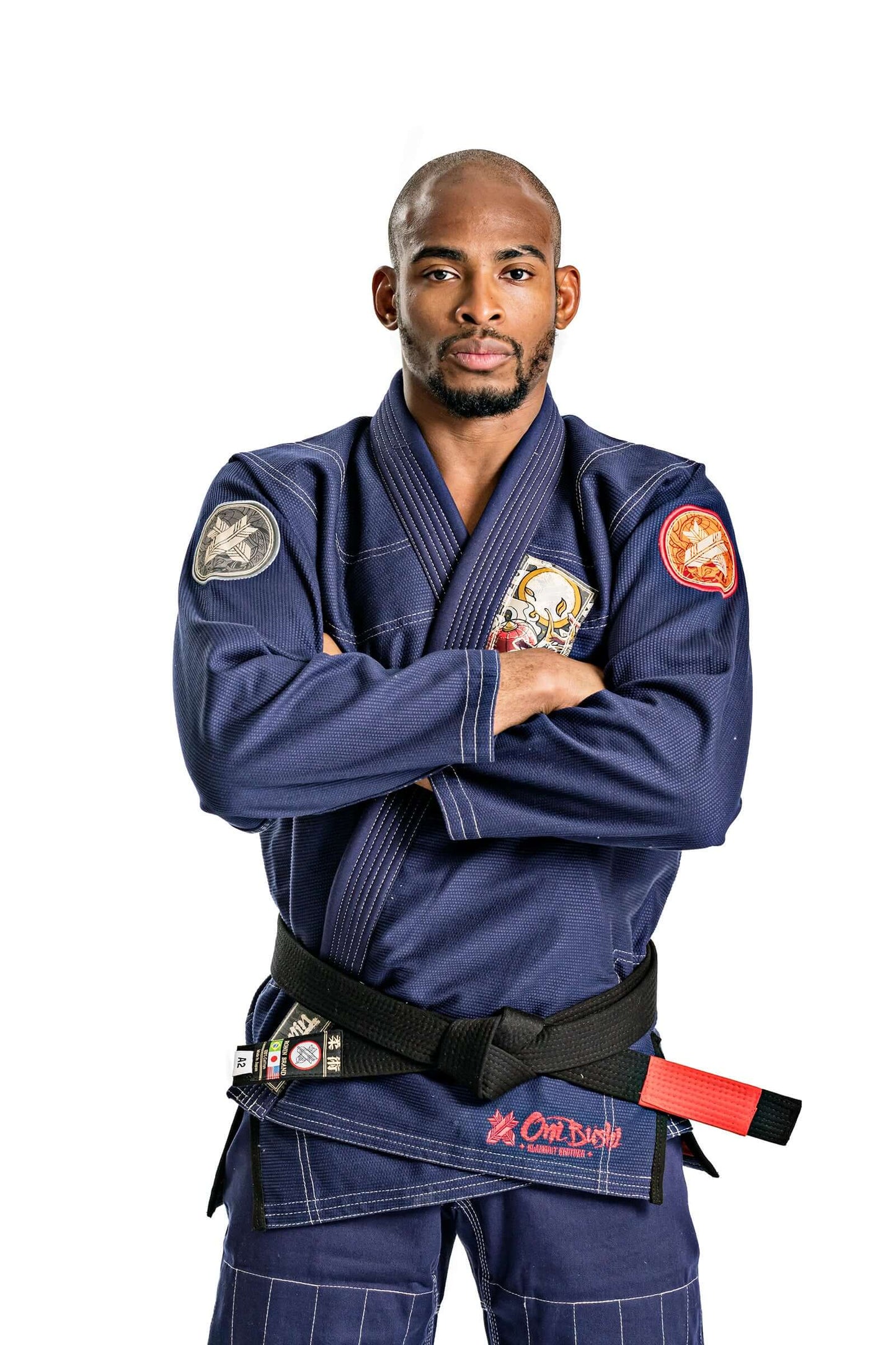 Model wearing Roninbrand Oni Bushi Navy BJJ gi, showcasing professional design and fit for Brazilian Jiu Jitsu practitioners.