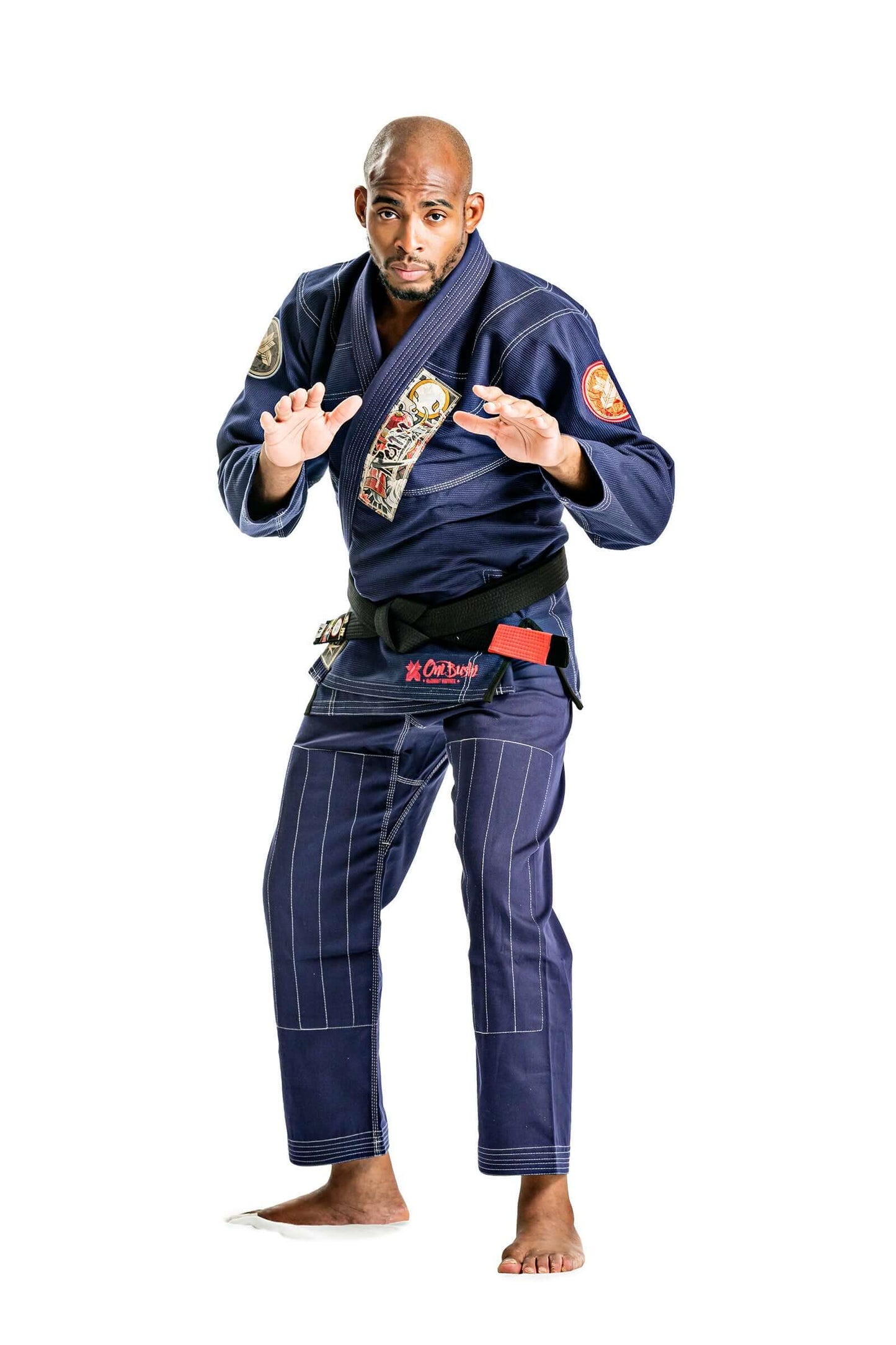 Model demonstrating the Roninbrand Oni Bushi BJJ Gi in Navy, showcasing professional fit and design for Brazilian Jiu Jitsu.