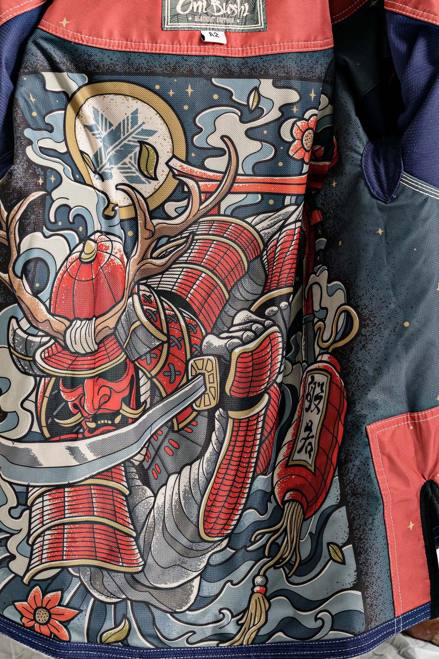Intricate artwork of a samurai warrior with a sword inside the Roninbrand Oni Bushi BJJ Gi, symbolizing strength and cunning.