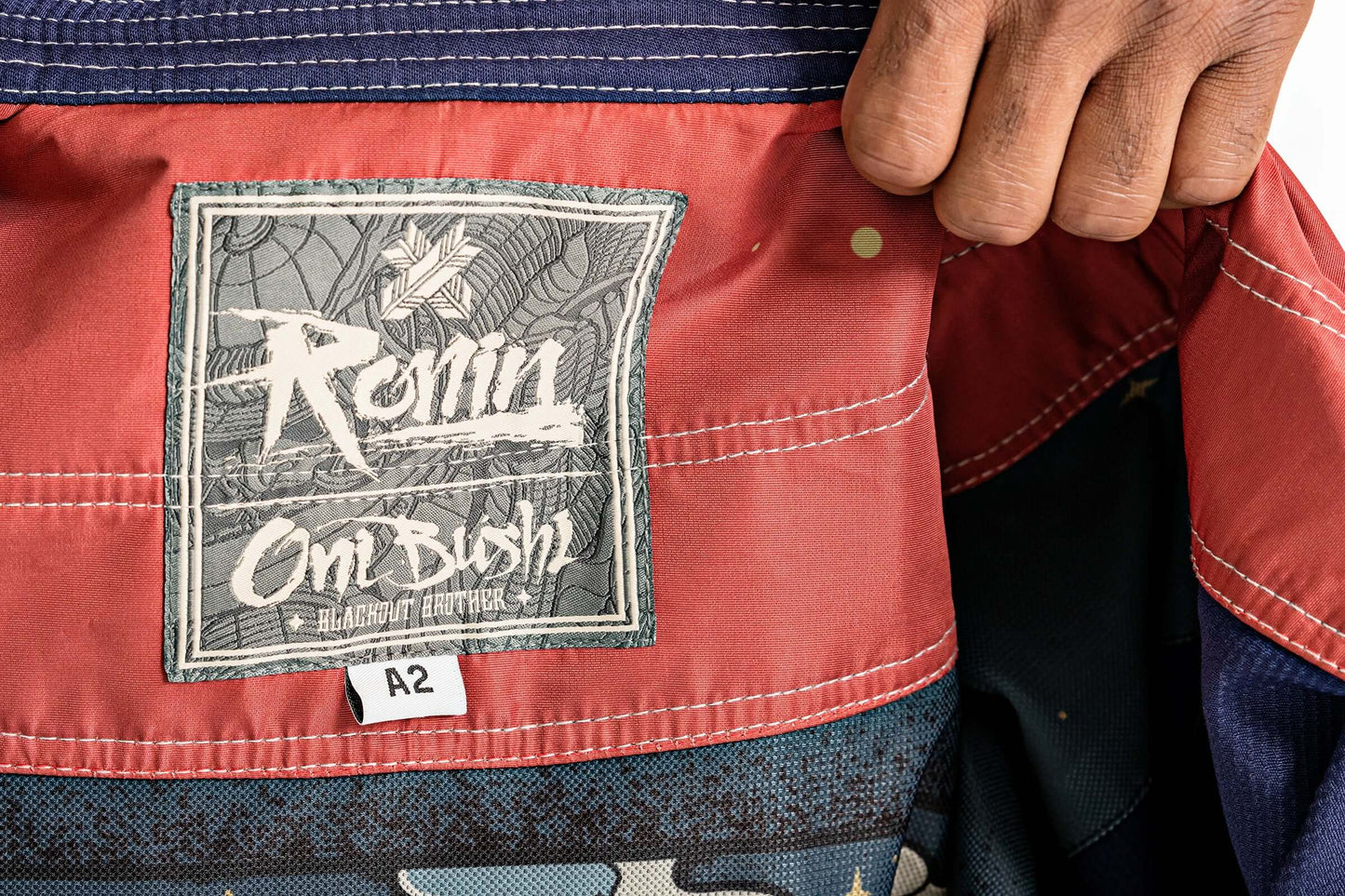 Interior label of Roninbrand Oni Bushi BJJ Gi showcasing size A2, designed for professional fighters.