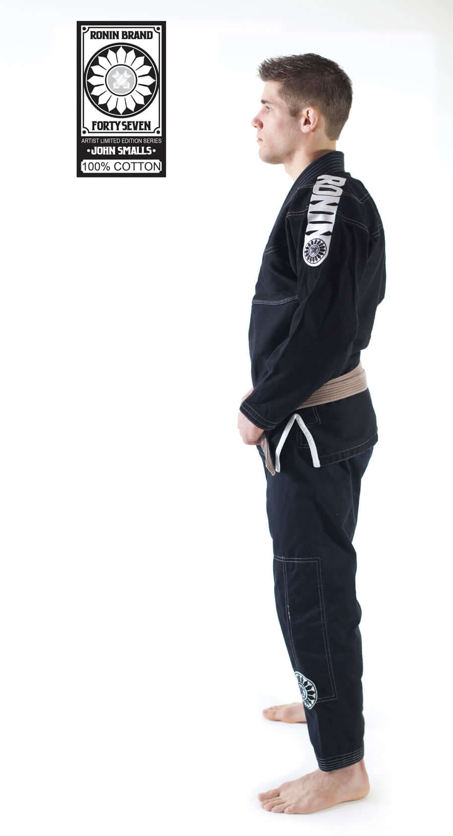 Side view of a male model wearing Roninbrand 47 BJJ Gi in Black, showcasing comfort and fit designed for fighters.
