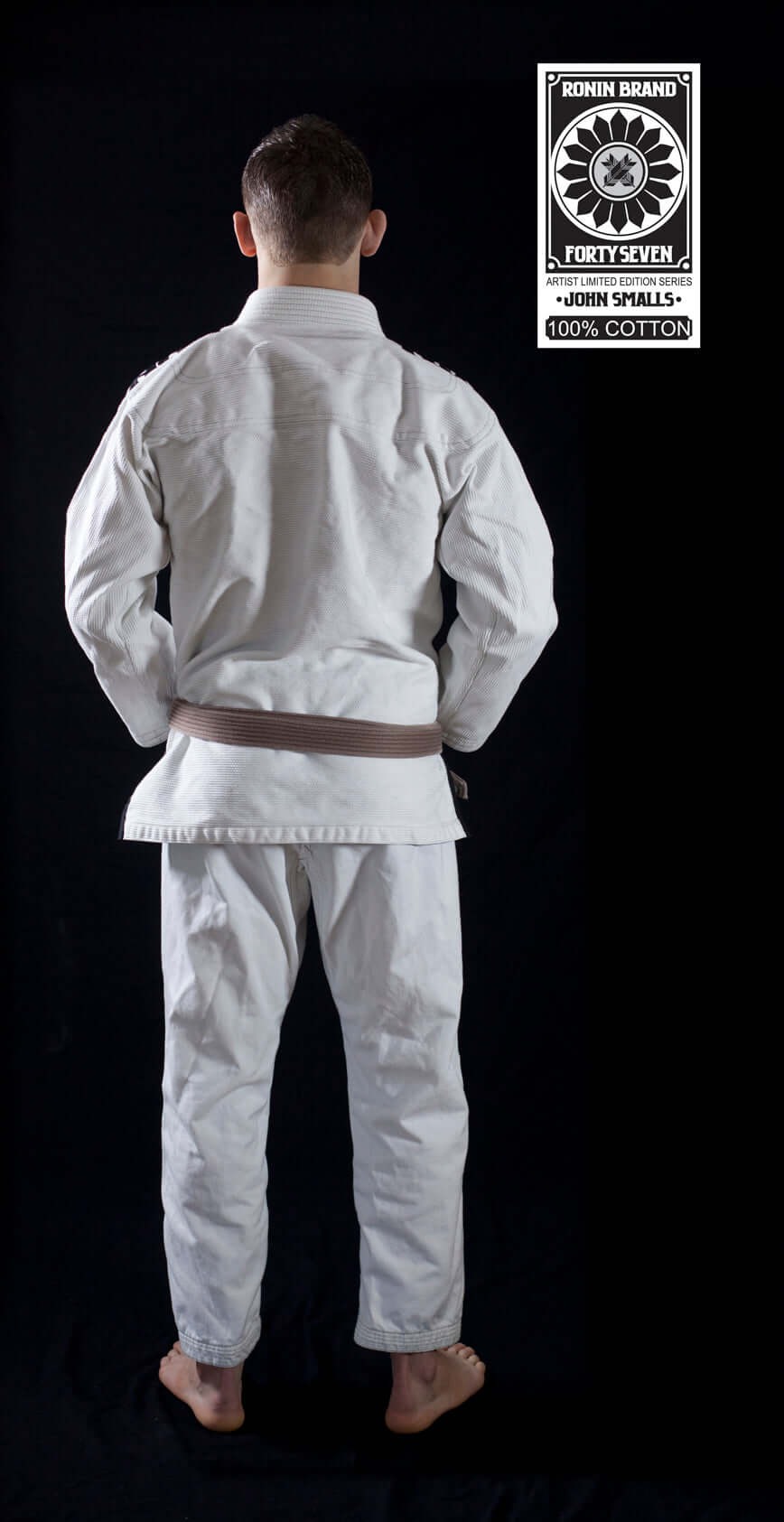 Back view of a male wearing the Roninbrand 47 BJJ Gi in white, showcasing its quality and fit.