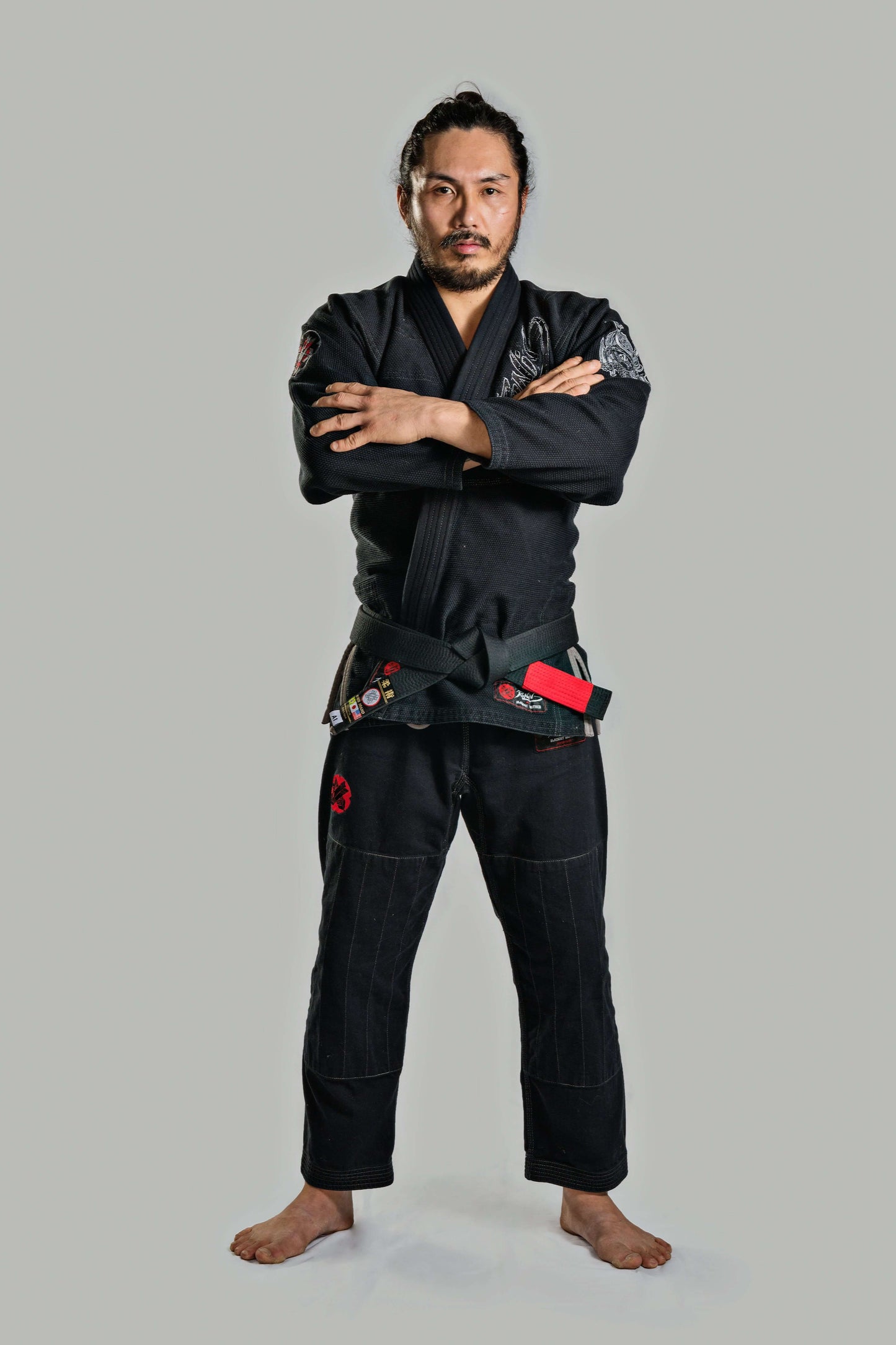 Roninbrand Samurai Ghost Black BJJ Gi worn by a fighter, showcasing professional fit and design for Brazilian Jiu Jitsu.