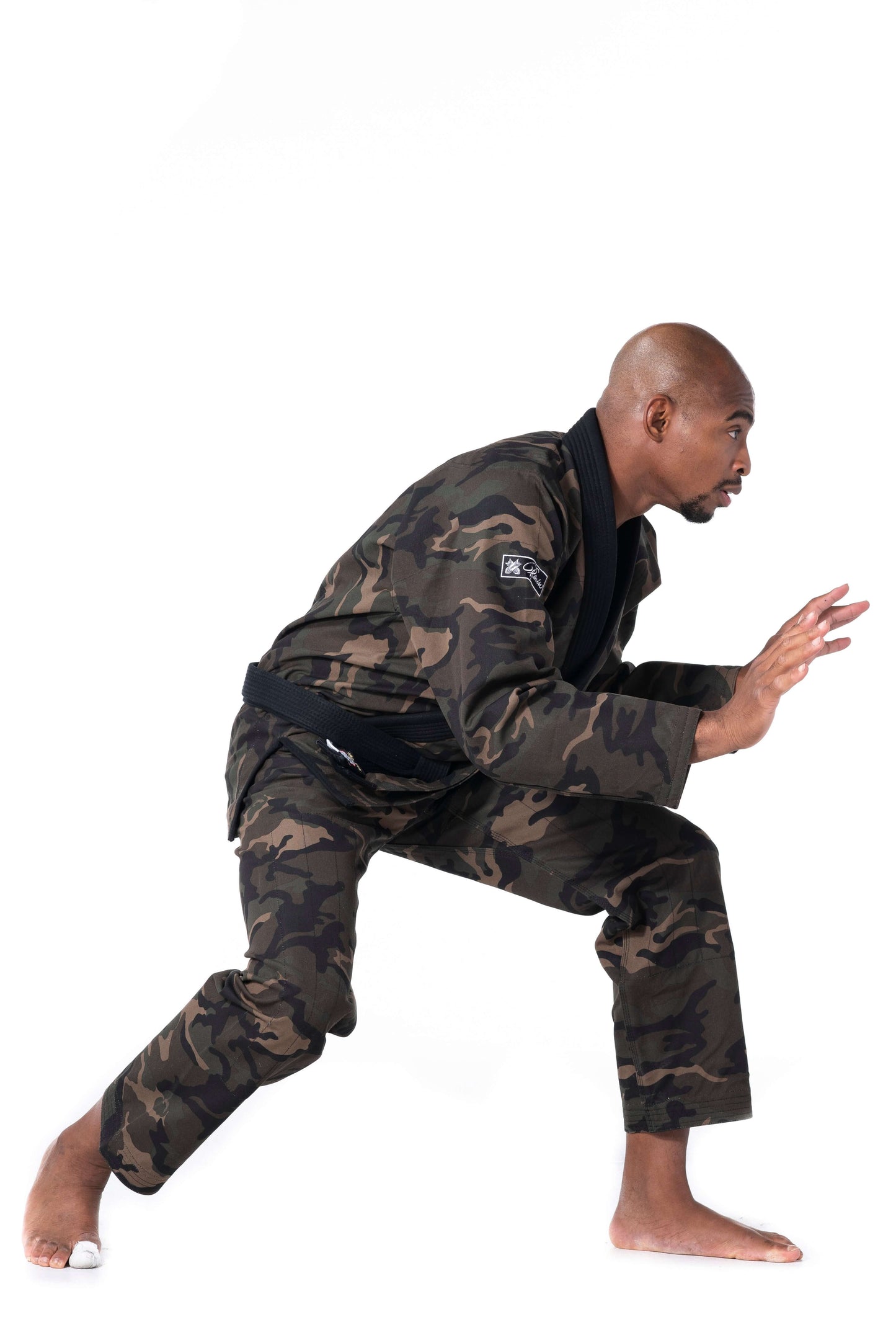 Roninbrand Camo BJJ Gi in green, showcasing a fighter in an action pose, perfect for grappling and combat.