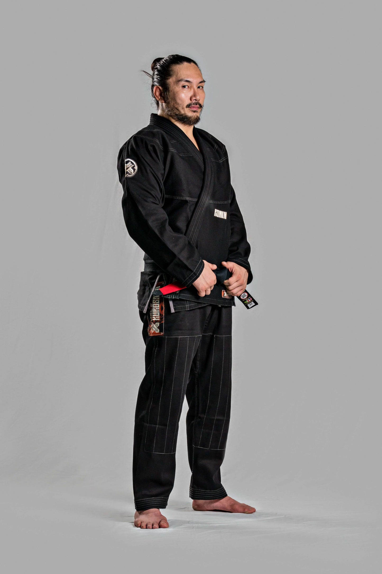 Model wearing Roninbrand Kurosawa BJJ Gi in black, showcasing comfort and style for professional Brazilian Jiu Jitsu.