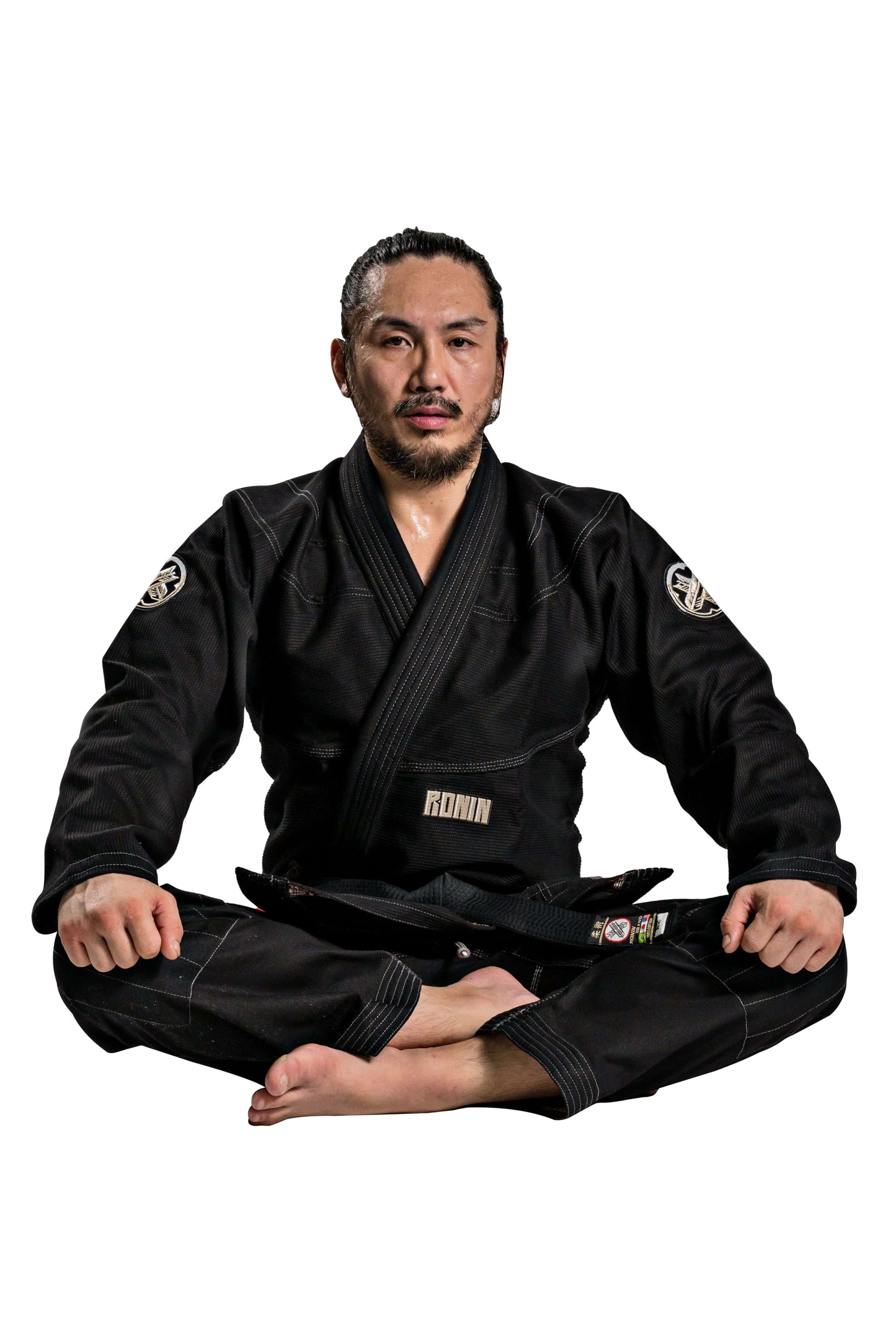 Man in Roninbrand Kurosawa BJJ Gi, showcasing professional Brazilian Jiu Jitsu attire for fighters, designed in America.