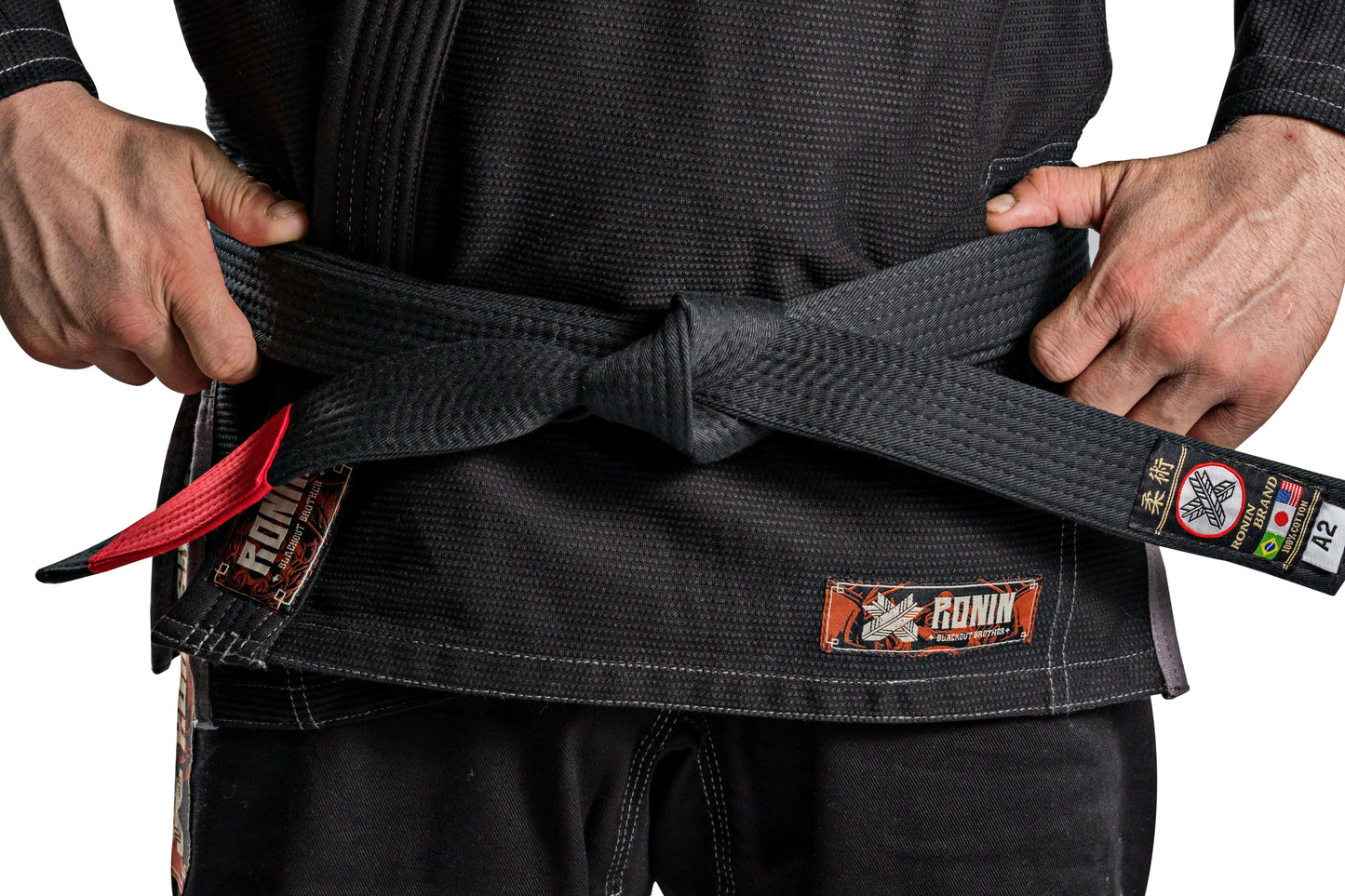 Close-up of a black Ronin BJJ Gi with a tied belt, showcasing craftsmanship and design for Brazilian Jiu Jitsu fighters.