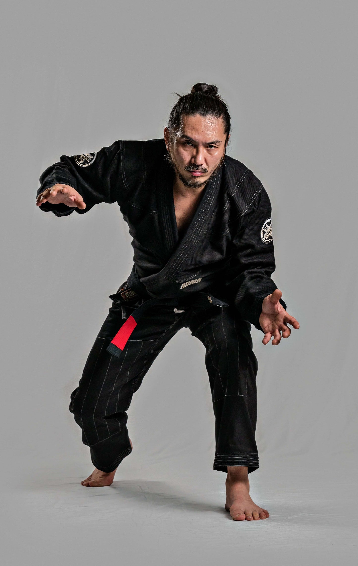 Roninbrand Kurosawa BJJ Gi in black, showcasing agility and readiness for Brazilian Jiu Jitsu fights.
