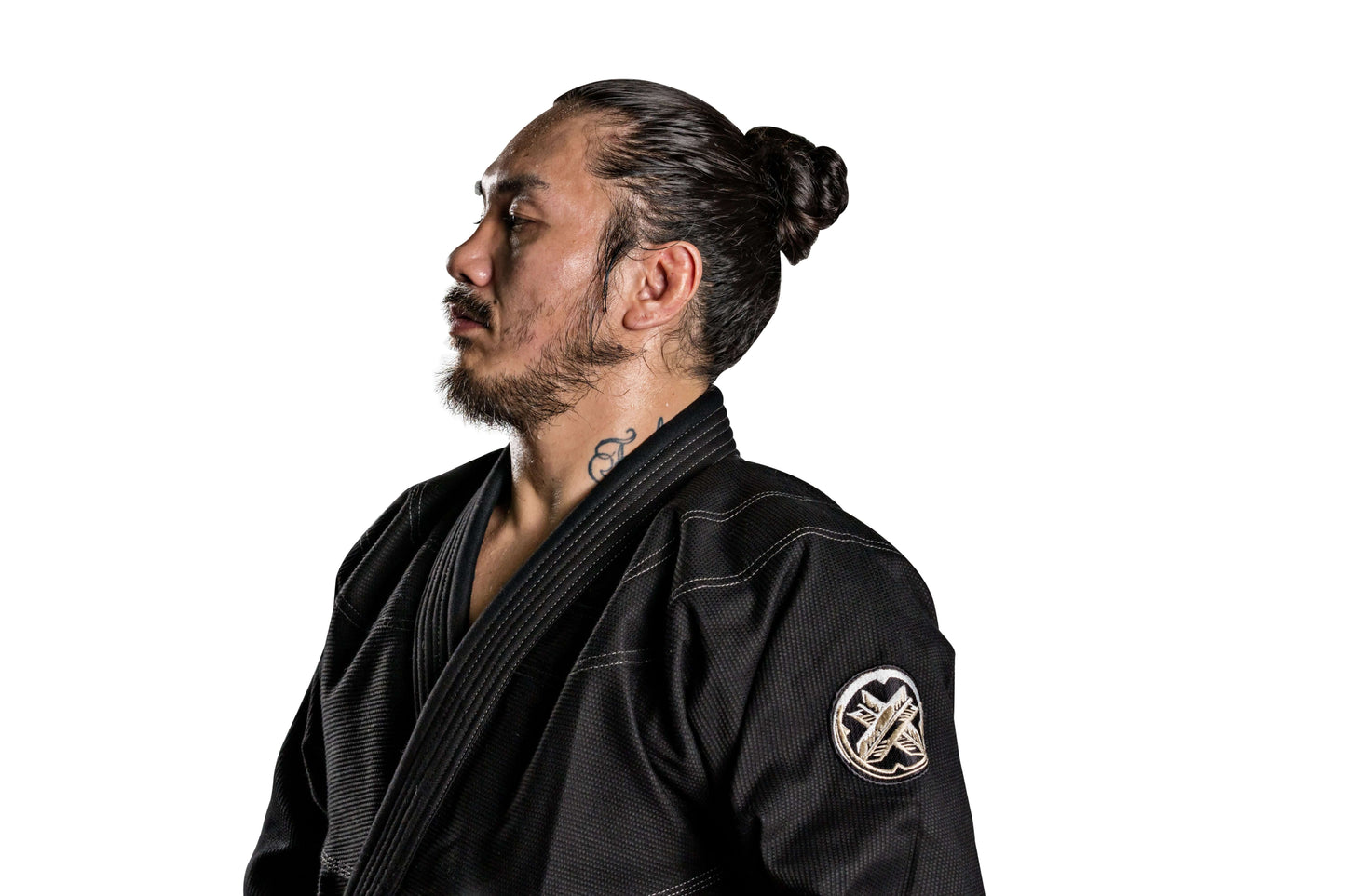 Man in Roninbrand Kurosawa BJJ Gi, showcasing premium design and comfort for Brazilian Jiu Jitsu practitioners.