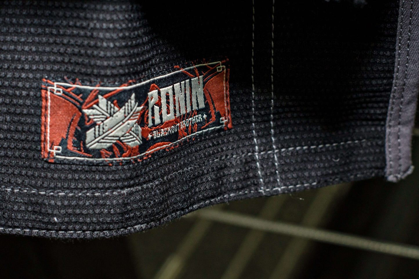 Roninbrand Kurosawa BJJ Gi label showcasing quality fabric and design for professional Brazilian Jiu Jitsu fighters.