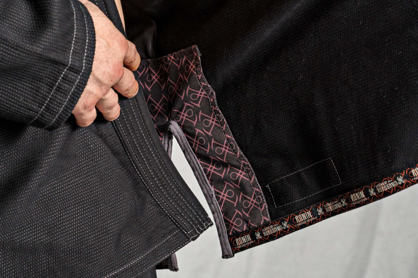 Close-up of Roninbrand Kurosawa BJJ Gi detailing, showcasing inner fabric design and superior craftsmanship for fighters.