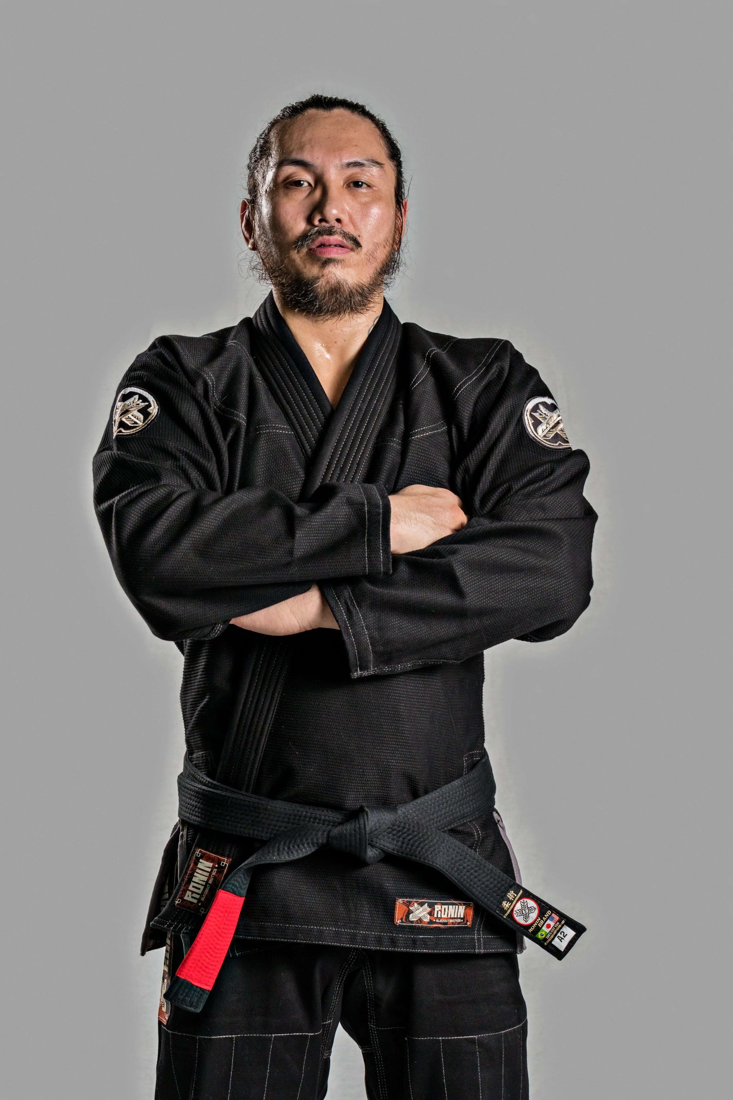 Model wearing Roninbrand Kurosawa BJJ Gi in black, showcasing professional fit and style for Brazilian Jiu Jitsu.
