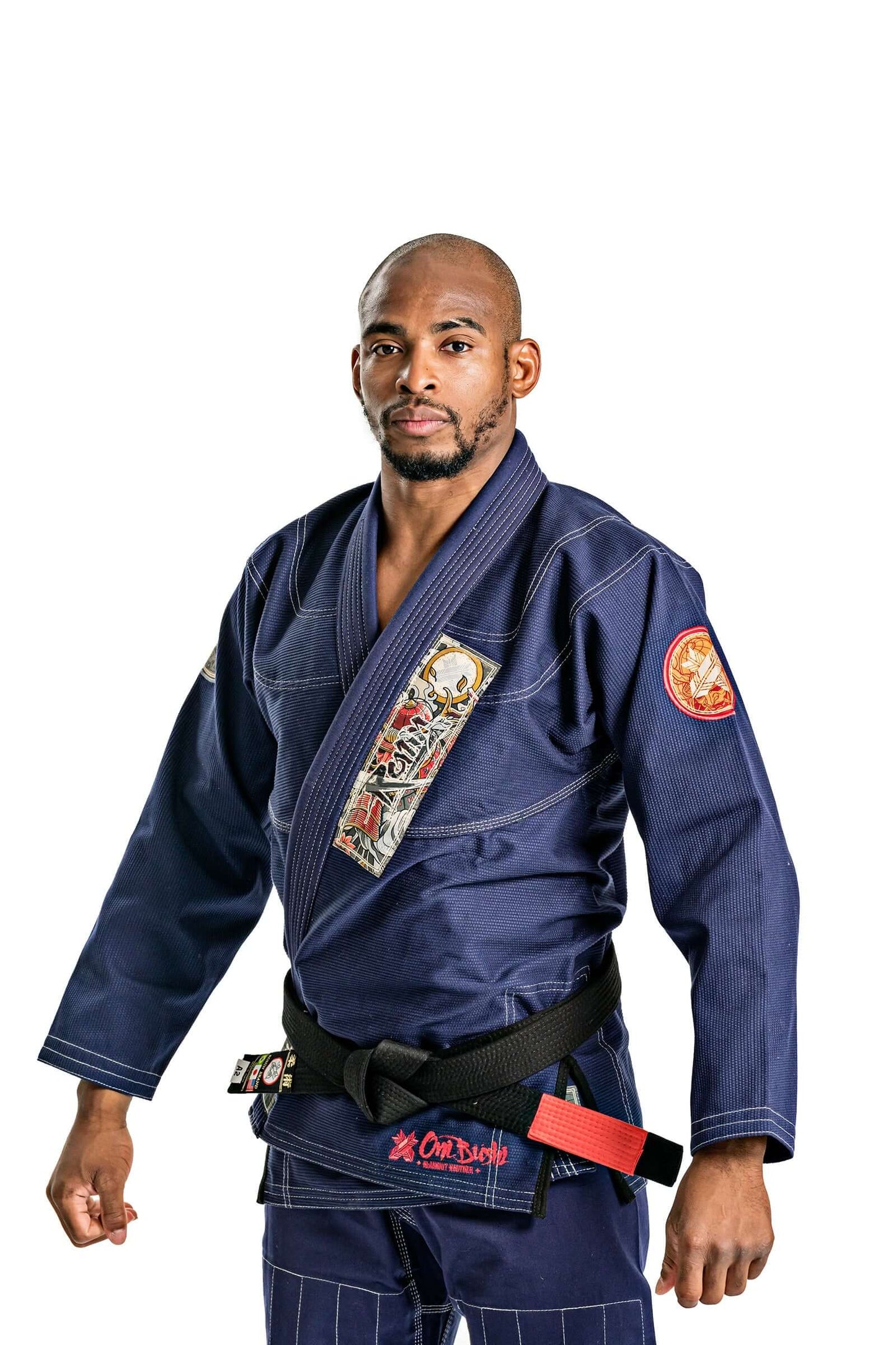 Man wearing Roninbrand Oni Bushi Navy BJJ Gi, showcasing comfort and design for professional Brazilian Jiu Jitsu fighters.