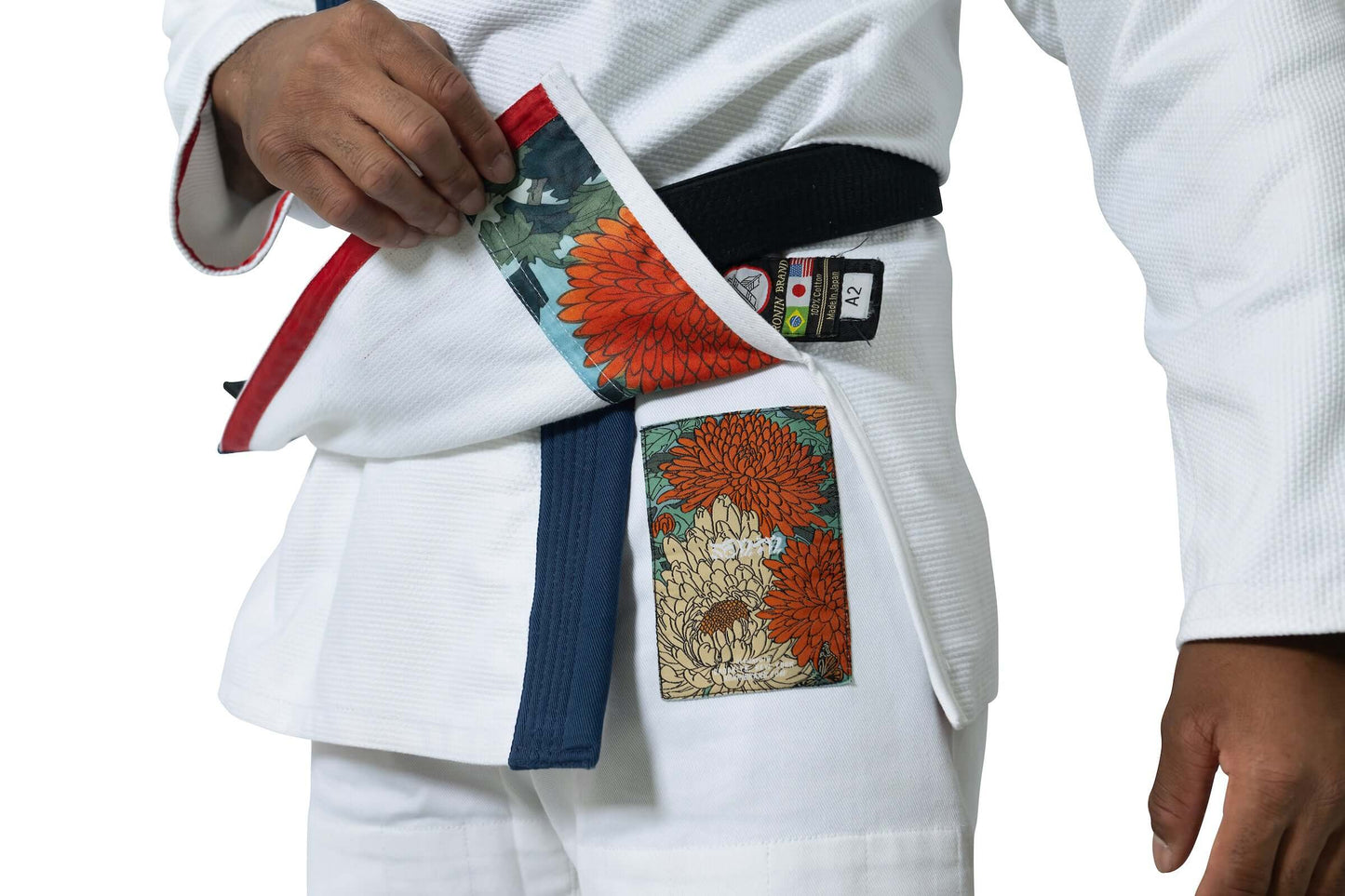 Roninbrand Shinsei Yūgure BJJ Gi details showing vibrant inner design and black belt for Brazilian Jiu Jitsu performance.