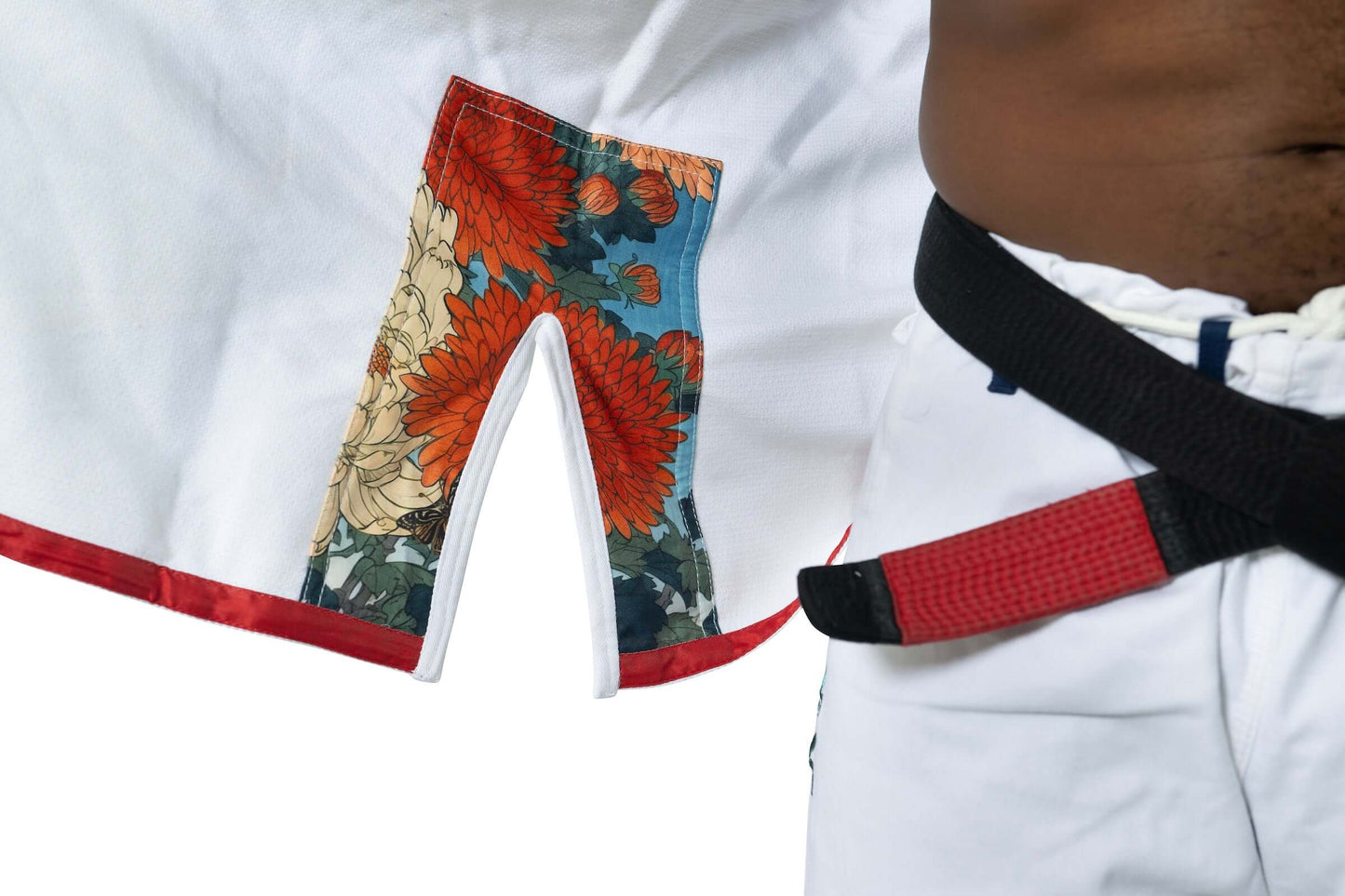 Detail of the Roninbrand Shinsei Yūgure BJJ Gi with floral fabric and belt, showcasing premium design for grappling.
