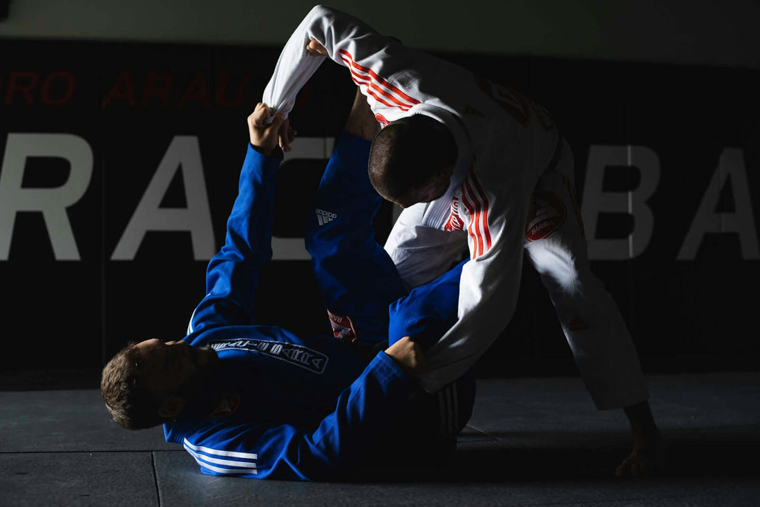 Fight during a professional BJJ match showcasing innovative Gi materials in action.