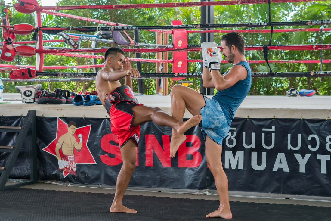Fight scene featuring two athletes training in a Muay Thai gym, showcasing advanced techniques in action.