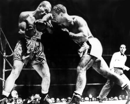 Boxing match between Rocky Marciano and Joe Louis, showcasing intense punches thrown in the ring.