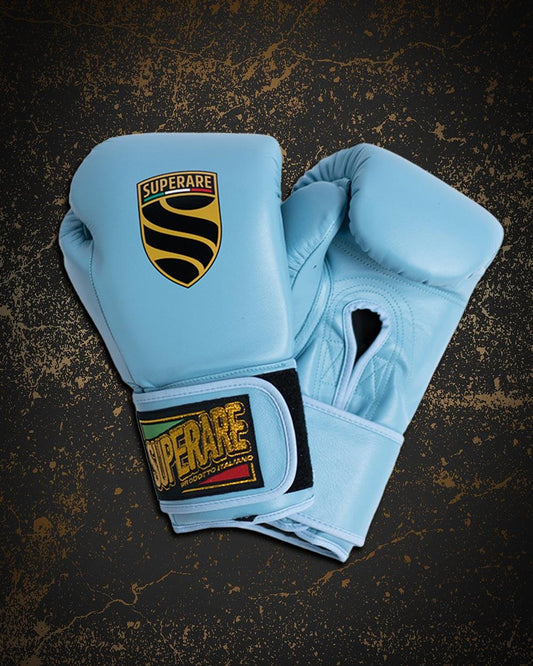 Brand new blue boxing gloves with Superare logo on a textured background, ideal for breaking in for boxing.
