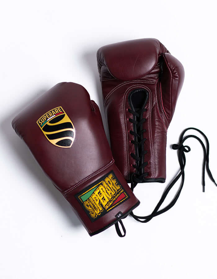 Fight gear - burgundy boxing gloves with logo and laces for ultimate protection and performance.