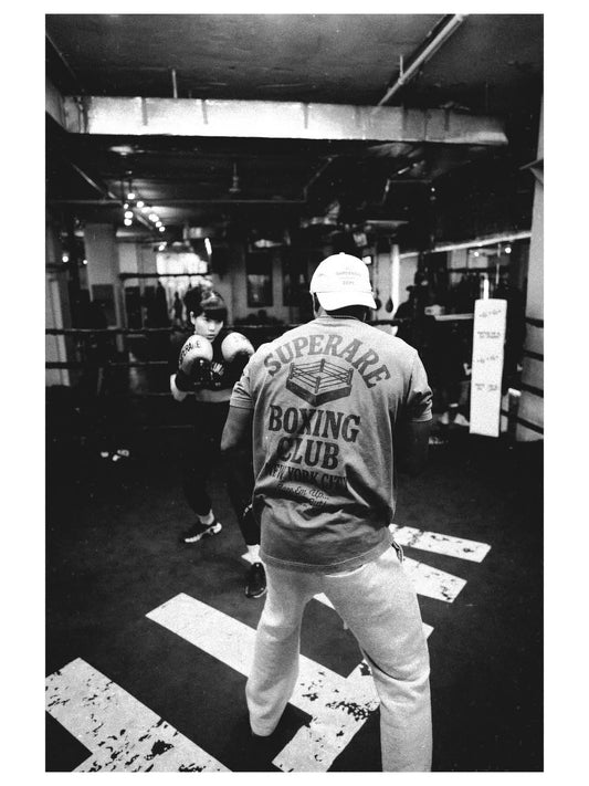 Boxing training session at Superrare Boxing Club with fighters preparing for intense drills.
