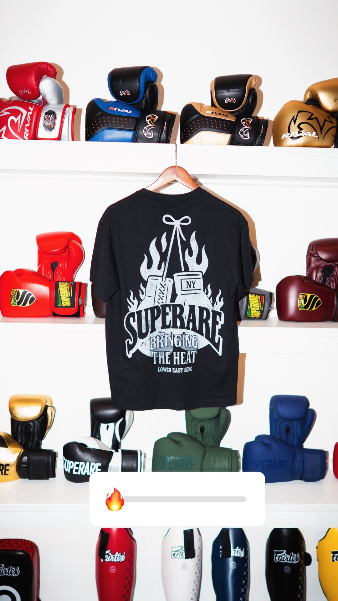 Boxing gear and a black t-shirt hanging on a wall, showcasing the spirit of Boxing and training.