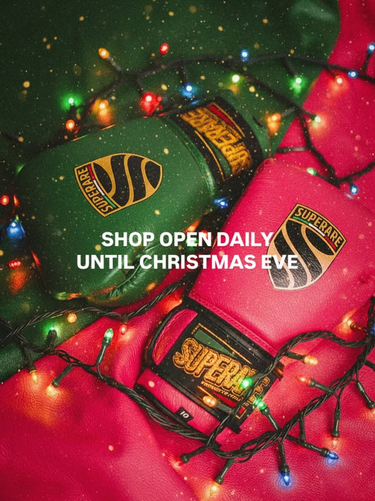 Martial Arts gloves in festive colors with Christmas lights, perfect for training and holiday shopping.