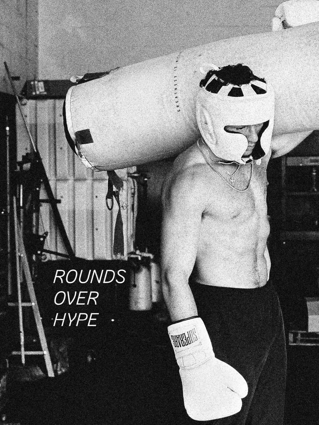 Fight Gear shows a boxer training intensely with a heavy bag over his shoulder.