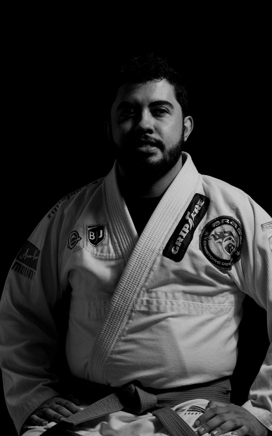 A Brazilian Jiu-Jitsu practitioner wearing a gi, representing fighting-grade materials in modern BJJ.