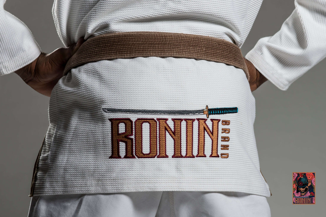BJJ gi featuring embroidery of the Ronin Brand logo on the back with a sword design.