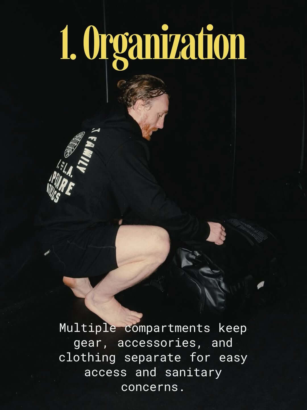A fighter demonstrating organization by using compartments for gear and clothing in boxing preparation.