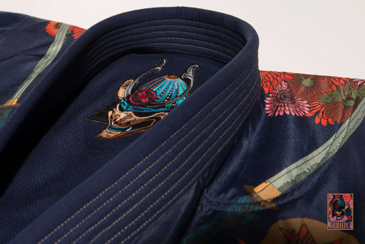 Detailed view of a Jiu Jitsu gi with floral designs and a samurai motif, perfect for training.