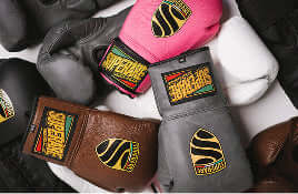 Boxing gloves in various colors and designs, ideal for Boxing and MMA training.
