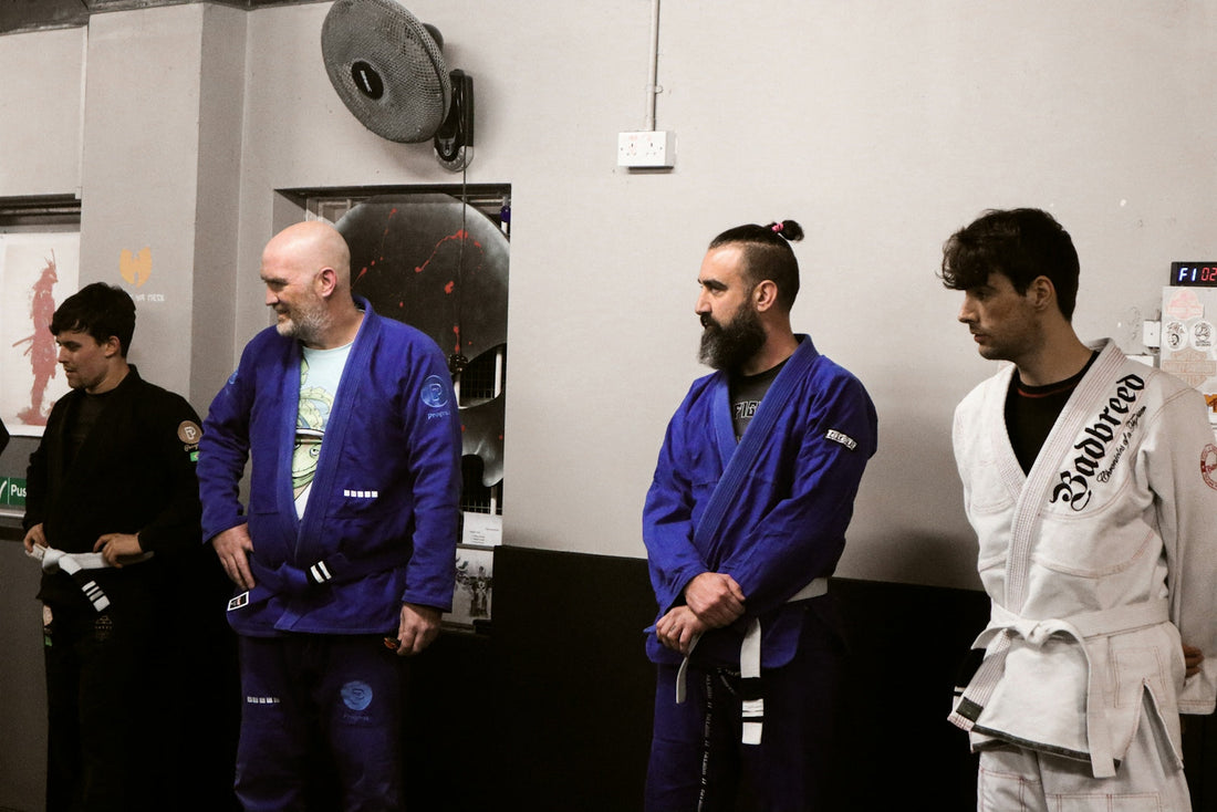 Fight in high-tech engineering showcased by BJJ practitioners in gi at a martial arts training session.