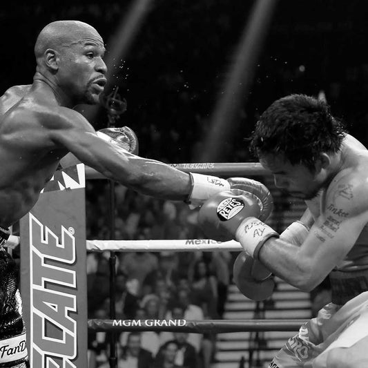 Floyd Mayweather Jr. delivers a powerful punch to Manny Pacquiao during their historic boxing match in 2015.