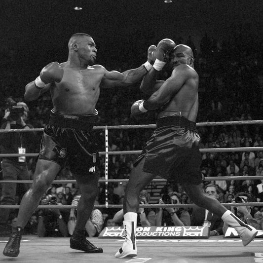 Mike Tyson throwing a punch at Evander Holyfield during their 1996 boxing match in Las Vegas.