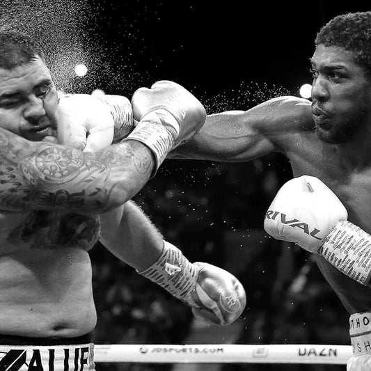 Anthony Joshua landing a punch on Andy Ruiz Jr. during their 2019 boxing match in Madison Square Garden.