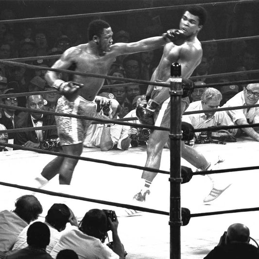Muhammad Ali and Joe Frazier engaged in a historic boxing match at Madison Square Garden, 1971.