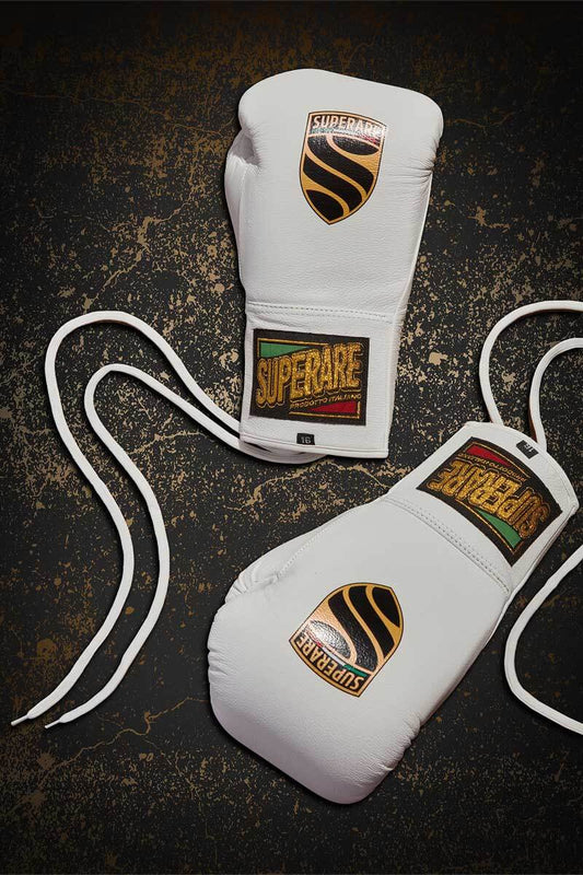 Fight boxing gloves on a textured surface representing the intensity of a Fight.