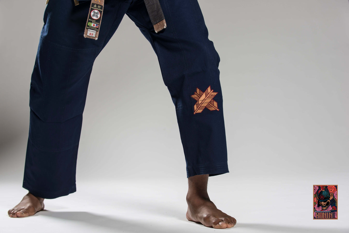 Navy Roninbrand Emperor BJJ Gi showcasing unique embroidery and ideal for combat and grappling techniques.
