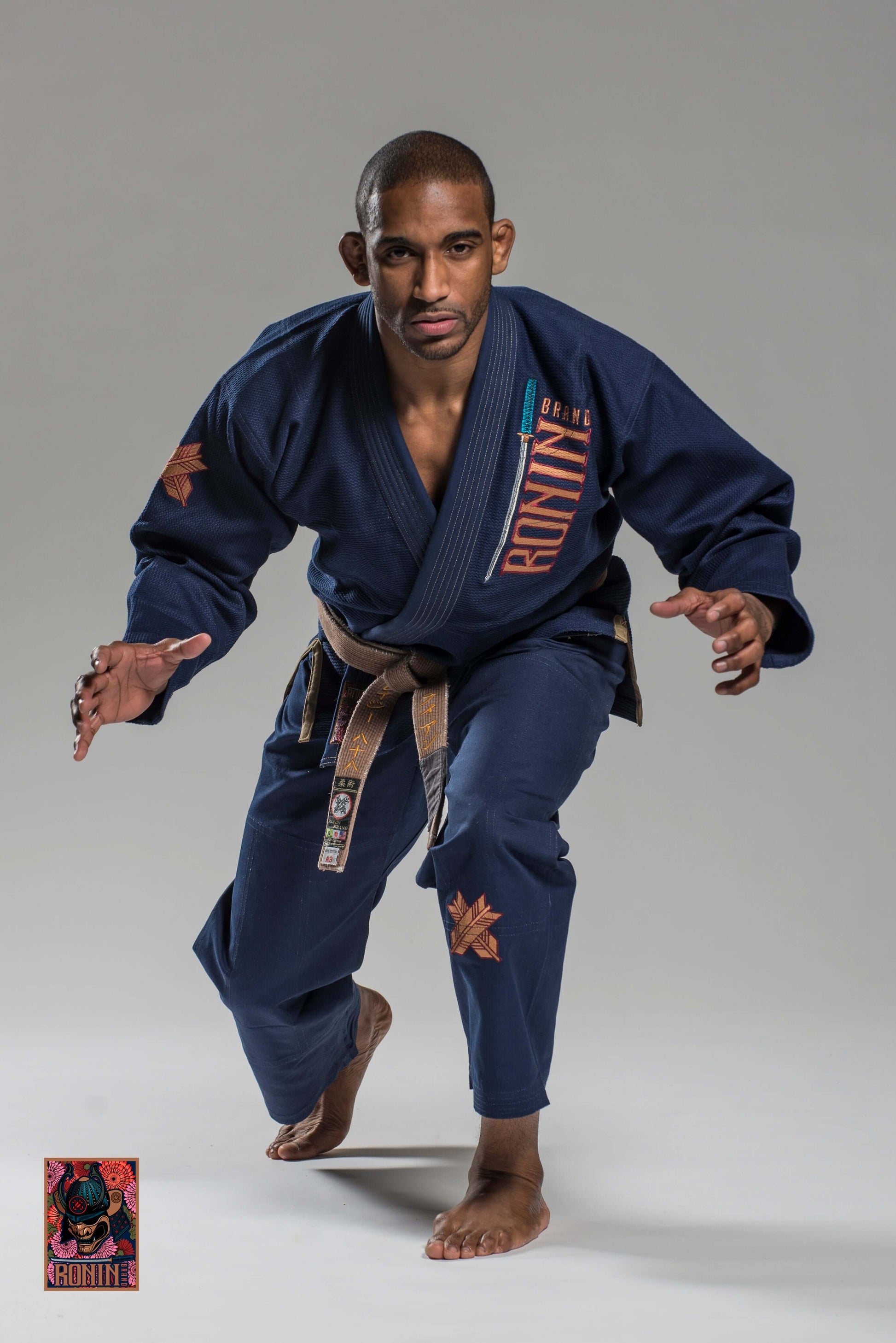 Roninbrand Navy Emperor BJJ Gi worn by a fighter in a ready stance, ideal for grappling and Brazilian Jiu Jitsu.