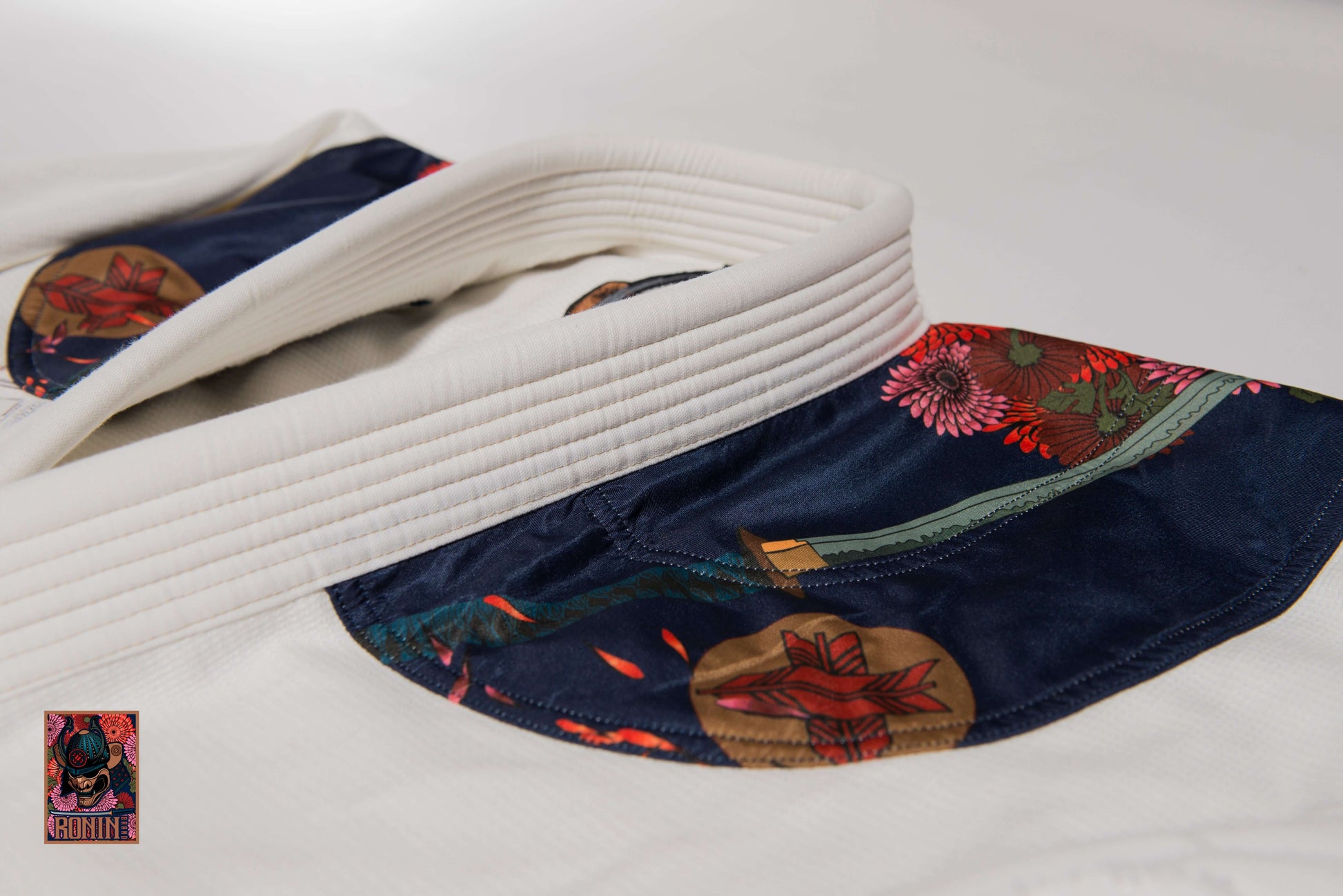 Roninbrand Emperor BJJ Gi collar detail showcasing intricate chrysanthemum embroidery and premium fabric design.