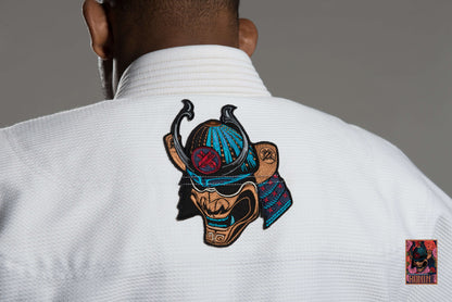 Back view of Roninbrand Emperor BJJ Gi featuring intricate samurai embroidery on a white fabric.