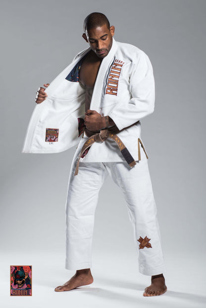 Man demonstrating Roninbrand Emperor BJJ Gi in white, showcasing comfort and design for Brazilian Jiu Jitsu training.