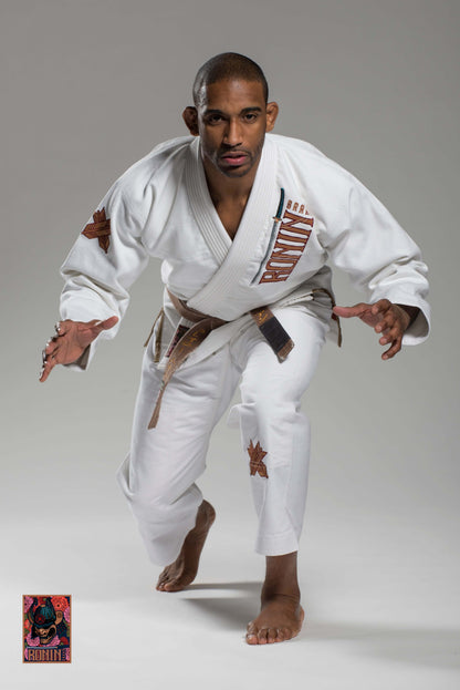 BJJ Gi Paragon Elite Fight x Ronin Emperor - White (Imperial Break) on a model demonstrating dynamic movement.